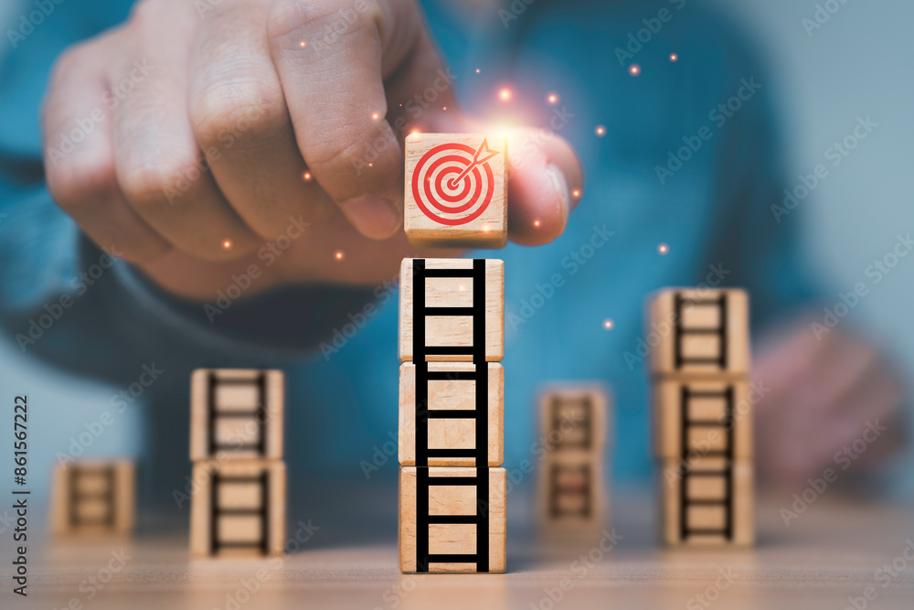 Poster businessman putting dartboard with arrow on the top of ladder for enhance and achievement setup busi
