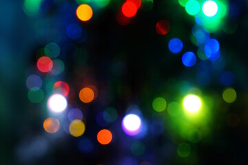 Christmas blurred background. A luminous Christmas tree garland. Christmas decorations.