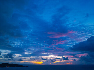 Obraz premium light pink cloud in the dark blue sunset.Unconventional and beautiful natural views of the sea..Nature video High quality footage..Unique and creative travel and nature idea