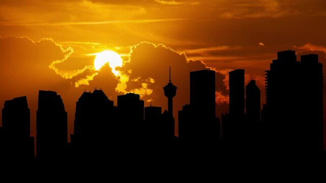 Calgary Skyline at Sunset, Time Lapse with Red  Sun and dramatic cloudy sky, Alberta, Canada