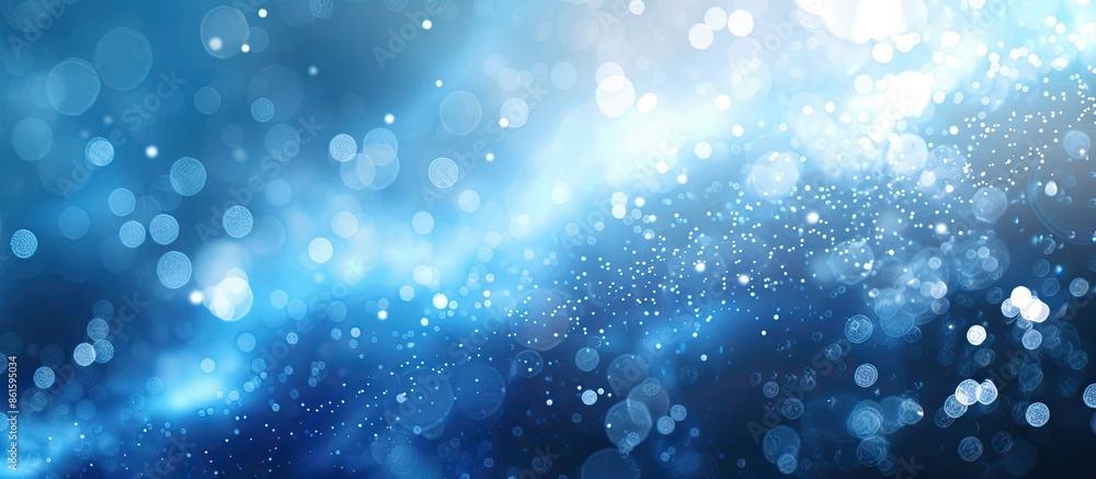 Leinwandbilder Blue particle background with abstract natural bokeh elements providing copy space image.