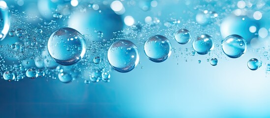 Blue bubbly texture with light, resembling water surface for product display or artwork design, like stunning jewelry, featuring copy space image.