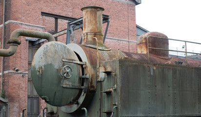 Industrial machines from an old abandoned coal mine, old and rusty.