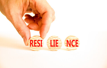 Resilience symbol. Concept word Resilience on beautiful wooden circles. Beautiful white table white background. Businessman hand. Business resilience concept. Copy space.