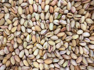 Pistachio texture. Hazelnut. Green fresh pistachios as texture. 