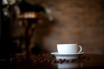 Cup of coffee on brown background