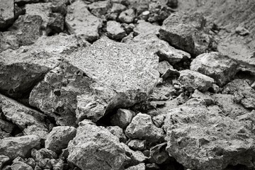 A pile of rocks with a large chunk missing