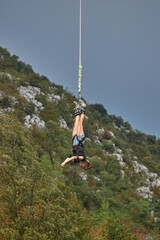 Bungee jumping young woman