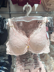 fashion sensuality lace bra hanging on rack in lingerie store. Female sensuality fashion