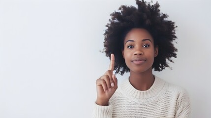 Confident African Woman with Curly Hair in Studio