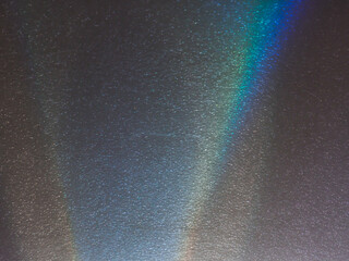 light reflections on a plastic sheet in the dark for an abstract background.      