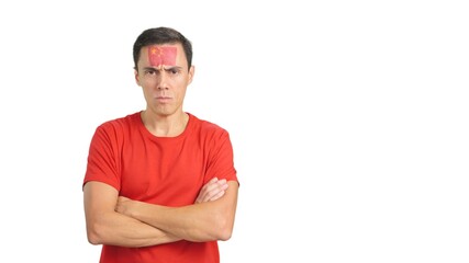 Dignified and serious man with chinese flag painted on face
