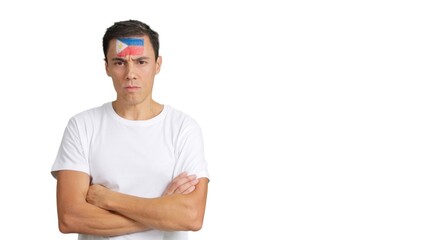 Fototapeta premium Dignified and serious man with philippine flag painted on face