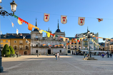 Fototapeta premium View of Ponferrada town hall building and square decorated for Templar Knights festivity.