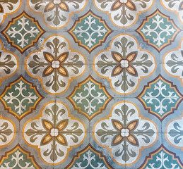 An elegant tile floor decorated with a charming floral pattern