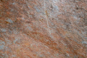 Textura de uma pedra de xisto com pequenas fissuras sobre a superficie