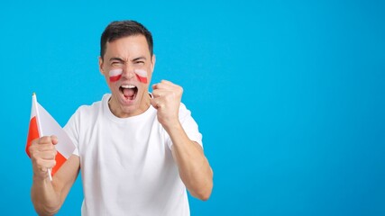 Man cheering for Poland screaming and waving a national flag
