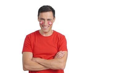 Fototapeta premium Man standing with swiss flag painted on face smiling