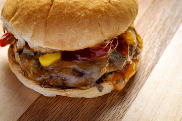 Straight from the grill, burger patty topped with cojack cheese, grilled onions, dill pickles,...