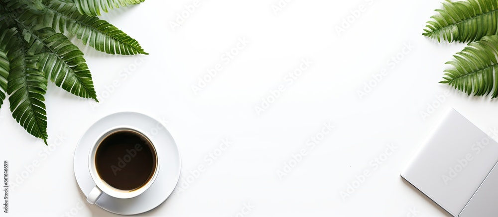 Poster Workspace items like a coffee cup, smartphone, notebook, tablet, and laptop are on a white background for a top view shot in flat lay style with copy space image.