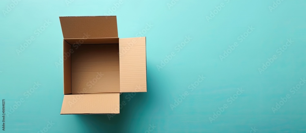 Aufkleber Cardboard box with empty space for text or graphics on a colored background, suitable for display or messages; copy space image.