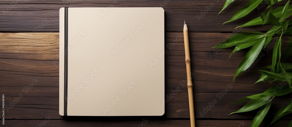 Poster Copy space image of a signature template on a rustic notebook with an eco-friendly pen, set against a backdrop of bamboo. Top-down view.