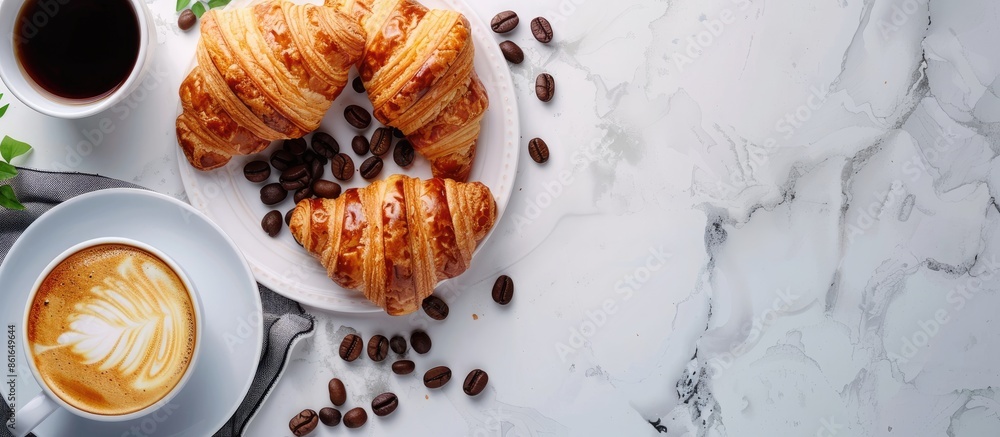 Aufkleber top-down view of a breakfast spread featuring espresso coffee, croissants, and ample copy space in t