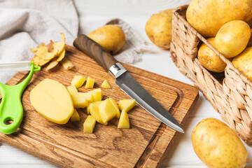 Young potatoes. Fresh potatoes  on a wooden background.Harvesting collection. organic, freshly dug potatoes. Agricultural background. Vegan. Vegetables.Place for text.Copy space