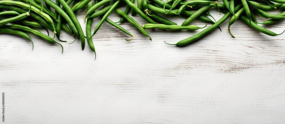 Aufkleber top view of fresh green beans arranged in scandinavian style on a white concrete table with copy spa