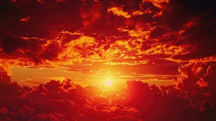 Image of a sunset with clouds in the background, great for use in travel or landscape photography contexts