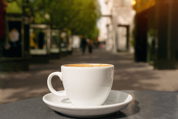 Cup of Coffee on Sunny Day in City Street