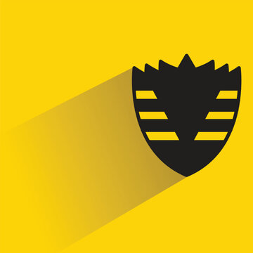 shield symbol with shadow on yellow background