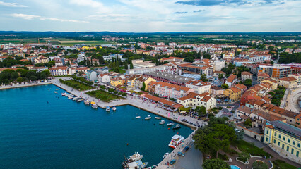 Obraz premium A stunning aerial view of Umag, a charming coastal town in Istria, Croatia. Known for its beautiful beaches, historic architecture, and vibrant marina, Umag offers a perfect blend of relaxation
