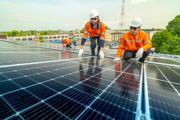 engineer man inspects construction of solar cell panel or photovoltaic cell by electronic device. Industrial Renewable energy of green power. factory worker working on tower roof.