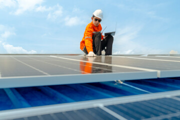 engineer man inspects construction of solar cell panel or photovoltaic cell by electronic device....