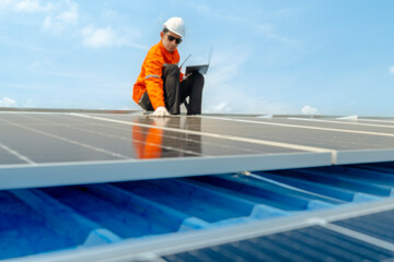 engineer man inspects construction of solar cell panel or photovoltaic cell by electronic device....