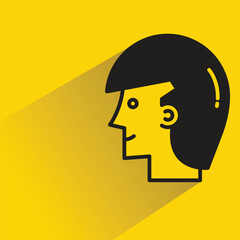 male face icon with shadow on yellow background