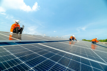 engineer man inspects construction of solar cell panel or photovoltaic cell by electronic device....