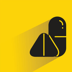 medicine pill with shadow on yellow background