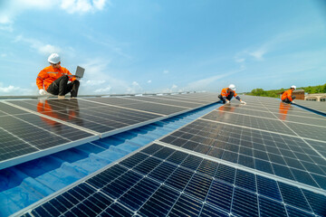 engineer man inspects construction of solar cell panel or photovoltaic cell by electronic device. Industrial Renewable energy of green power. factory worker working on tower roof.