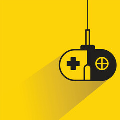 game controller and joystick icon on yellow background