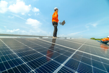 engineer man inspects construction of solar cell panel or photovoltaic cell by electronic device. Industrial Renewable energy of green power. factory worker working on tower roof.