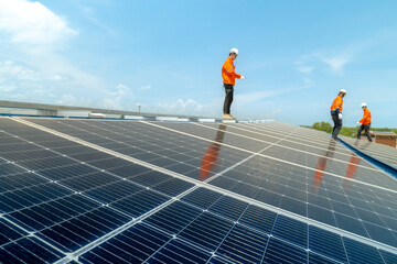 engineer man inspects construction of solar cell panel or photovoltaic cell by electronic device....