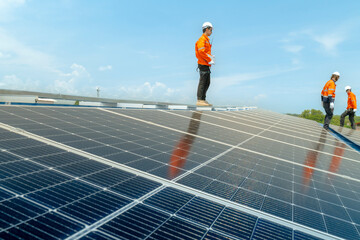 engineer man inspects construction of solar cell panel or photovoltaic cell by electronic device....