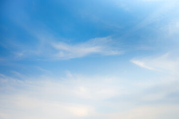Soft gentle blue sky with light clouds. Calm texture. Nature abstract background. Fresh air, weather and freedom concept