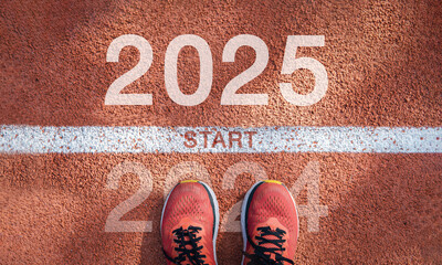 New year 2025 concept, beginning of success. Text 2025 written on asphalt road and male runner...