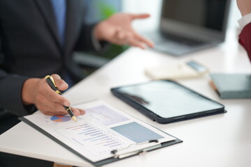 Group of business professionals work together and discuss marketing strategies. Business teams have planning skills regarding long-term financial plans. Close-up pictures