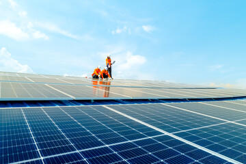 engineer man inspects construction of solar cell panel or photovoltaic cell by electronic device....