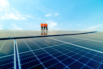 engineer man inspects construction of solar cell panel or photovoltaic cell by electronic device....