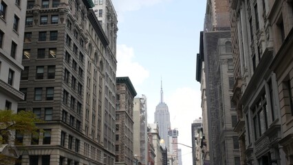 New York City Manhattan Midtown street architecture. Empire State building, iconic skyscraper in USA. American urban cityscape, famous NYC tower, United States. 5th Fifth 5 avenue. Greenwich village.